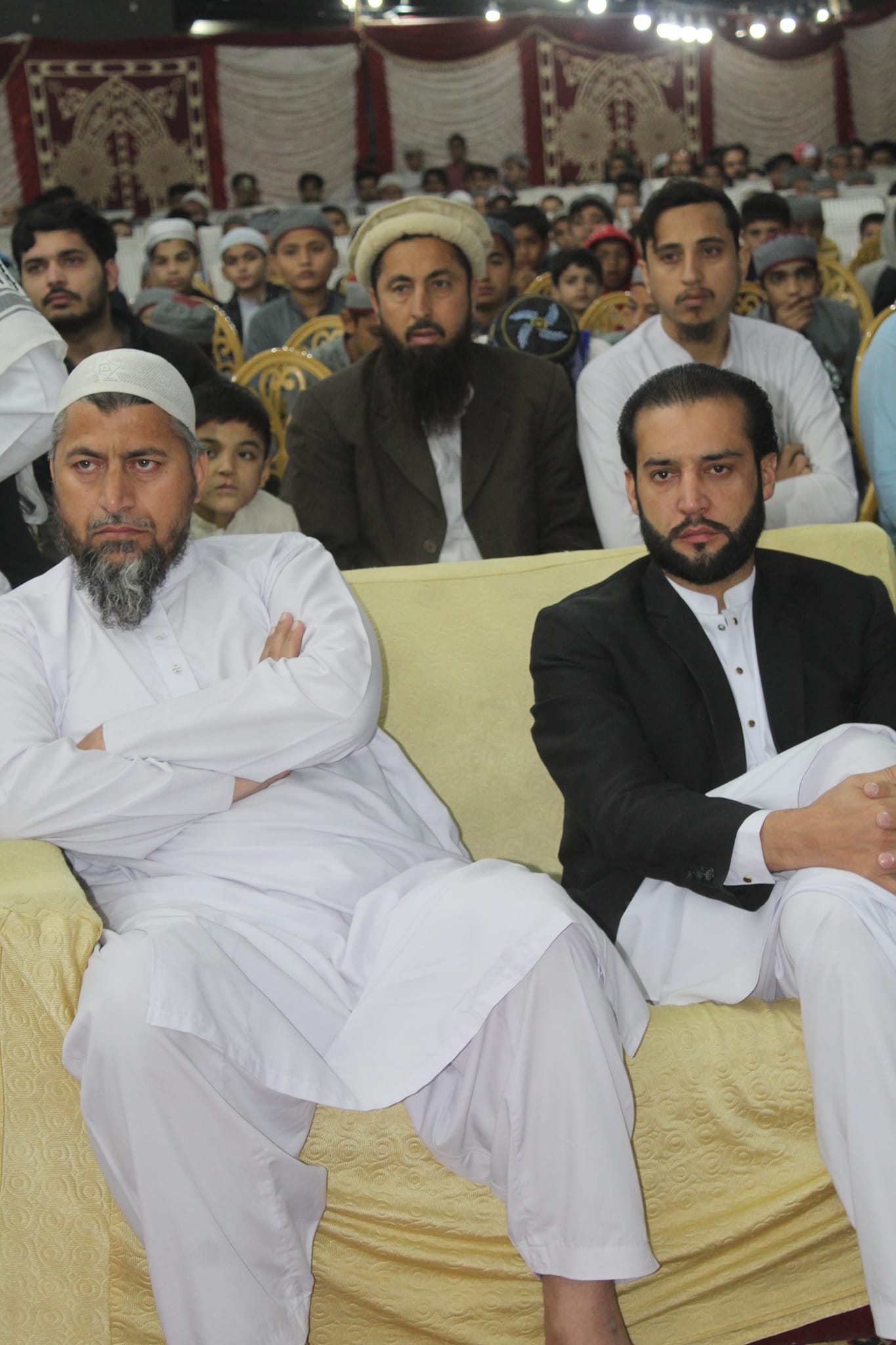 Person sitting in a modern building with a scenic view